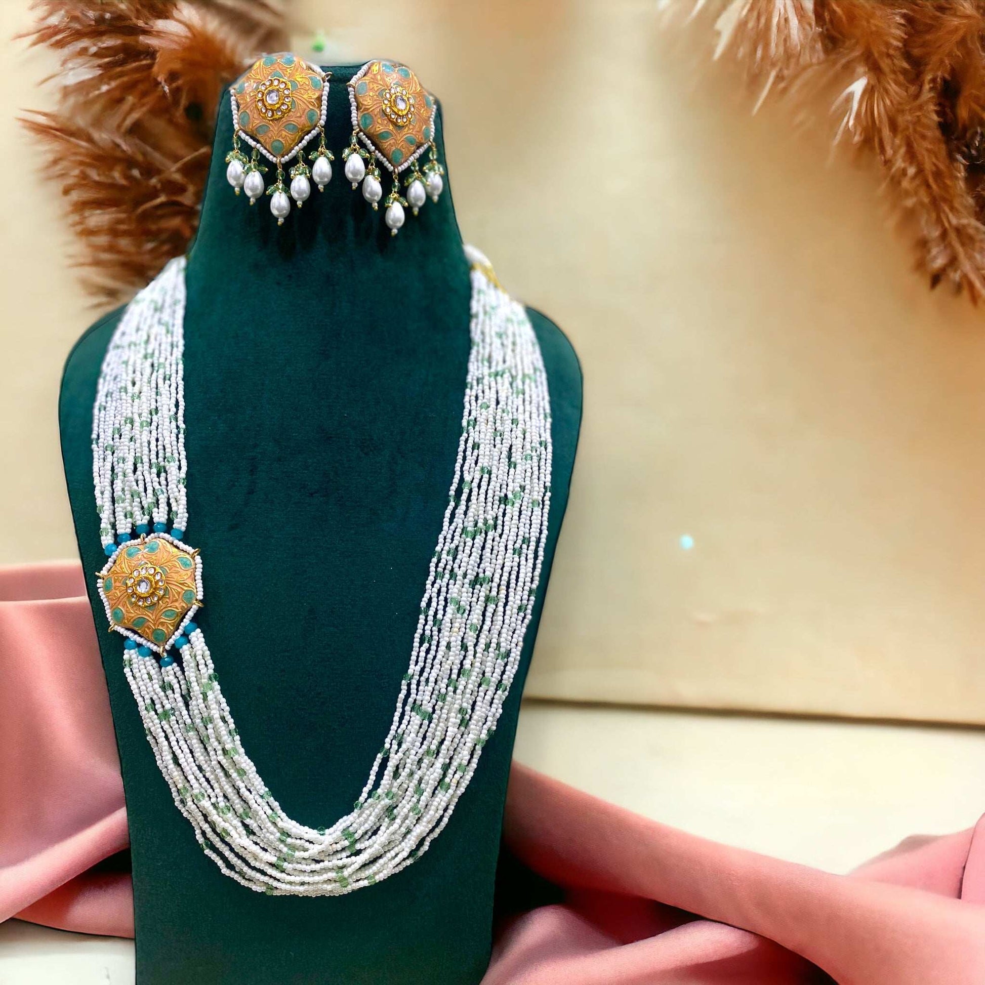 Saira Peach Meenakari
Necklace Set - Pirohee by parul sharma